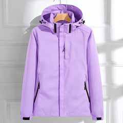 Victoria women's waterproof hooded rain jacket by Christine Brewer showing adjustable fit and waterproof fabric on a model.