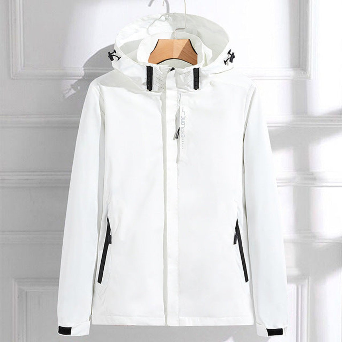 Victoria women's waterproof hooded rain jacket by Christine Brewer, featuring adjustable fit and durable waterproof material.