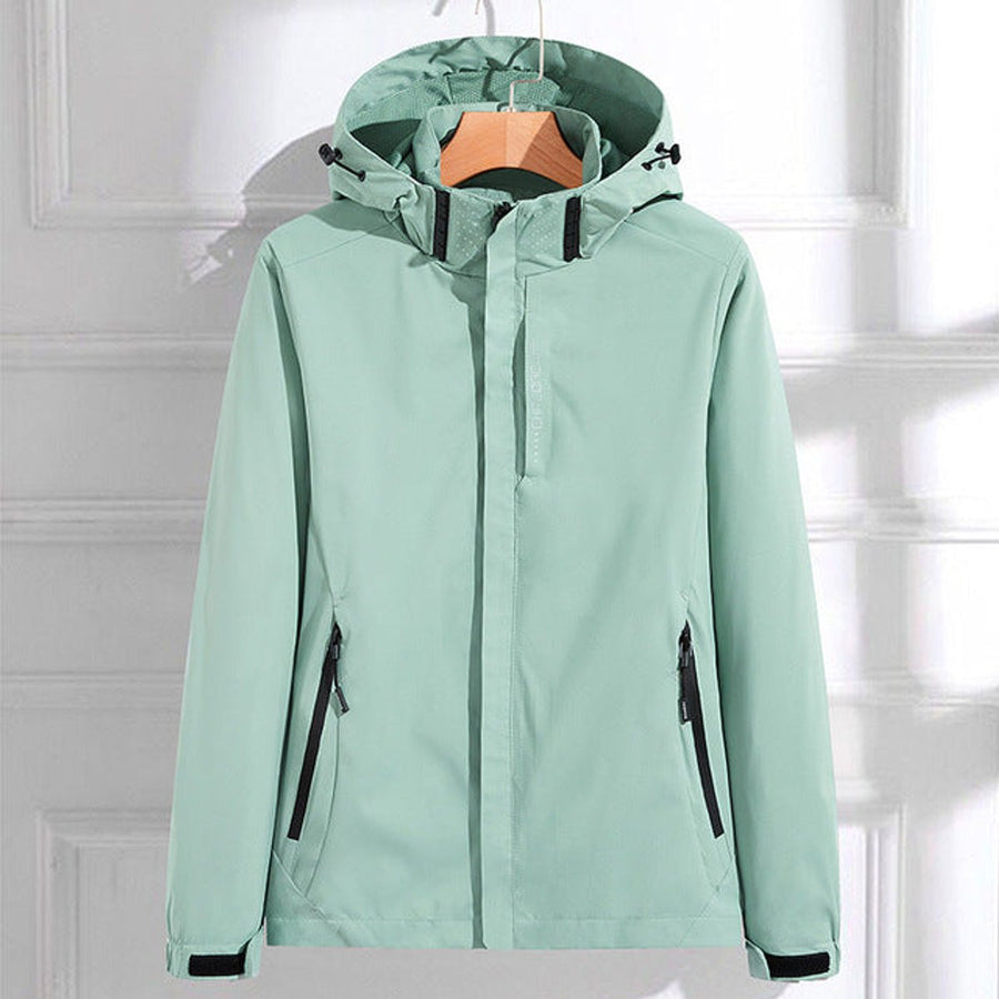 Women’s waterproof hooded rain jacket by Christine Brewer with adjustable fit, suitable for wet weather and outdoor activities.