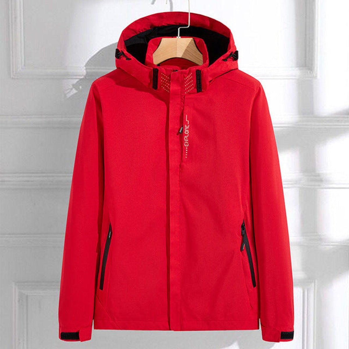 Women's waterproof hooded rain jacket with adjustable fit by Christine Brewer, featuring a lightweight design and practical hood.