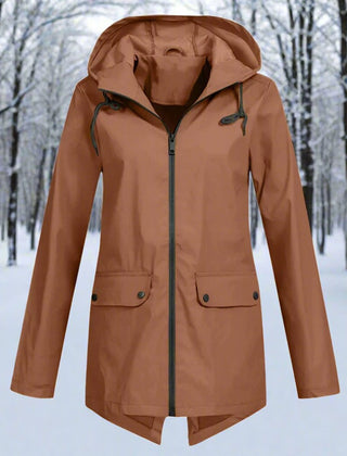 Women’s waterproof hooded rain jacket by Christine Brewer, longline zip-up design with adjustable hood, suitable for rainy weather.
