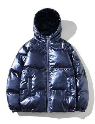 Xenia windproof metallic blue puffer jacket for women by Christine Brewer, featuring a hood and cozy insulation.