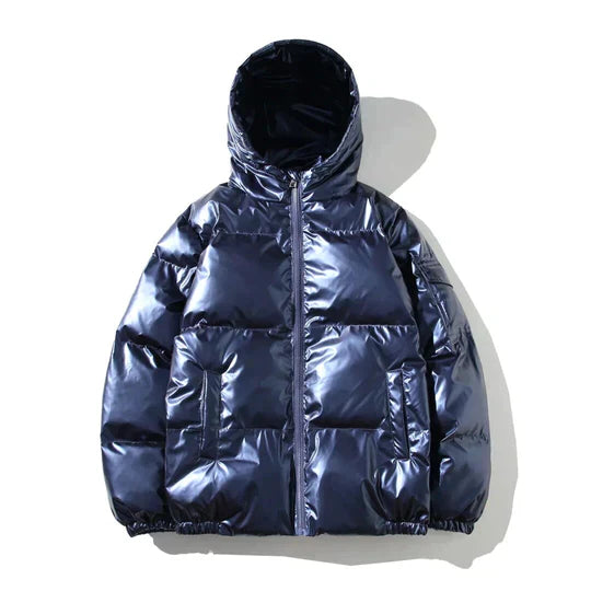 Xenia windproof metallic blue puffer jacket for women by Christine Brewer, featuring a hood and cozy insulation.