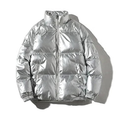 Xenia silver metallic puffer jacket for women by Christine Brewer, showcasing a windproof, cozy puffer style with a shiny finish.