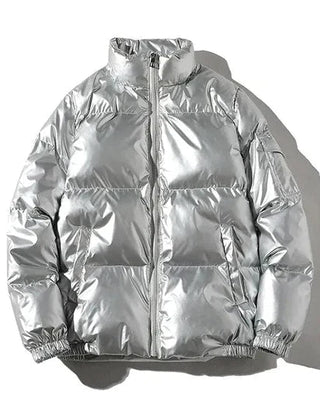 Xenia silver metallic puffer jacket for women by Christine Brewer, showcasing a windproof, cozy puffer style with a shiny finish.