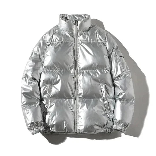Xenia silver metallic puffer jacket for women by Christine Brewer, showcasing a windproof, cozy puffer style with a shiny finish.