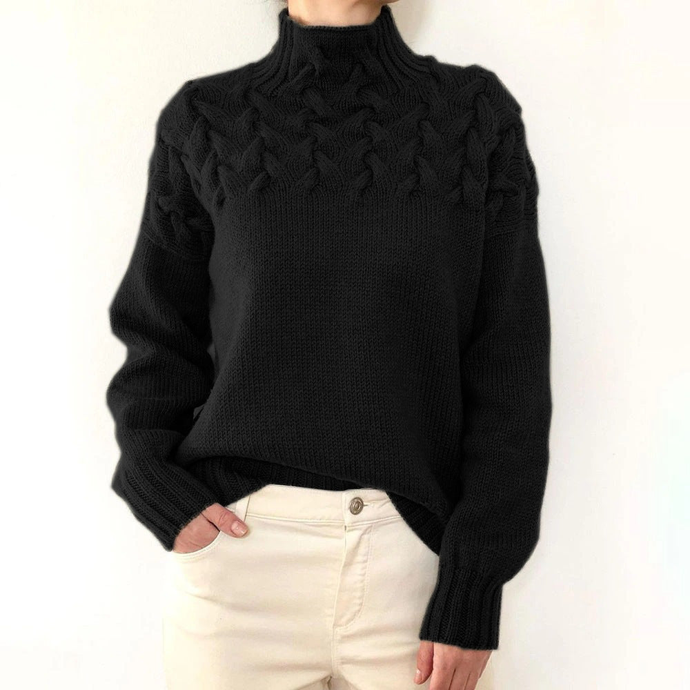 Black women's Tessa turtleneck sweater by Christine Brewer, cozy knitwear with a fitted design and ribbed collar.